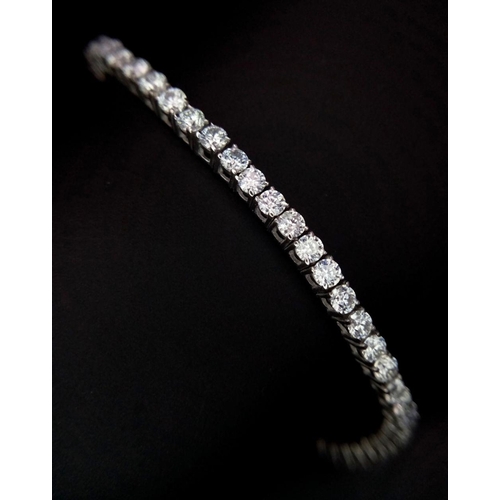 603 - An 18K White Gold Diamond Tennis Bracelet. 3ctw of brilliant round cut diamonds. 17cm length. 8.4g t... 