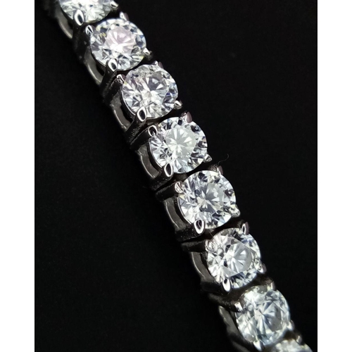 603 - An 18K White Gold Diamond Tennis Bracelet. 3ctw of brilliant round cut diamonds. 17cm length. 8.4g t... 