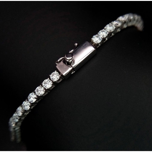 603 - An 18K White Gold Diamond Tennis Bracelet. 3ctw of brilliant round cut diamonds. 17cm length. 8.4g t... 