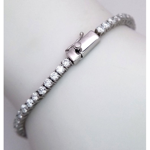 603 - An 18K White Gold Diamond Tennis Bracelet. 3ctw of brilliant round cut diamonds. 17cm length. 8.4g t... 