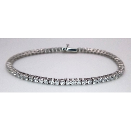 603 - An 18K White Gold Diamond Tennis Bracelet. 3ctw of brilliant round cut diamonds. 17cm length. 8.4g t... 