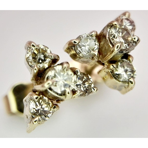 617 - A Pair of 18K Yellow Gold, Four Diamond Stud Earrings. Eight round cut diamonds in trillion form. 2.... 