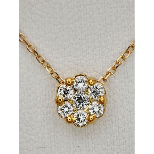 631 - An 18K Yellow Gold and Diamond Cluster Pendant on an 18K Yellow Gold Disappearing Necklace. 5mm pend... 