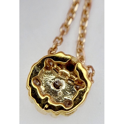 631 - An 18K Yellow Gold and Diamond Cluster Pendant on an 18K Yellow Gold Disappearing Necklace. 5mm pend... 