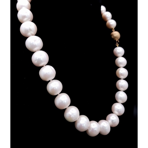 652 - A Large Pearl Bead Necklace with 9K Gold Fancy Clasp. Pearls - 14/15mm. Necklace length - 42cm.