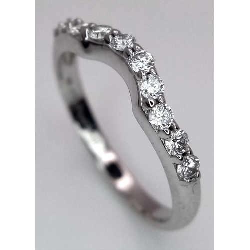 653 - A Designer, Michael Hill 18K White Gold and Diamond Ring. 10 round cut diamonds. Size K 1/2. 2.4g to... 