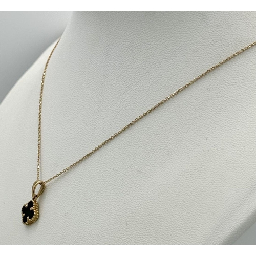 660 - An 18K Gold and Black Onyx Clover Pendant on an 18K Yellow Gold Disappearing Necklace. 12mm pendant.... 