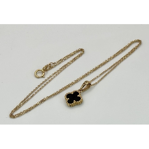 660 - An 18K Gold and Black Onyx Clover Pendant on an 18K Yellow Gold Disappearing Necklace. 12mm pendant.... 