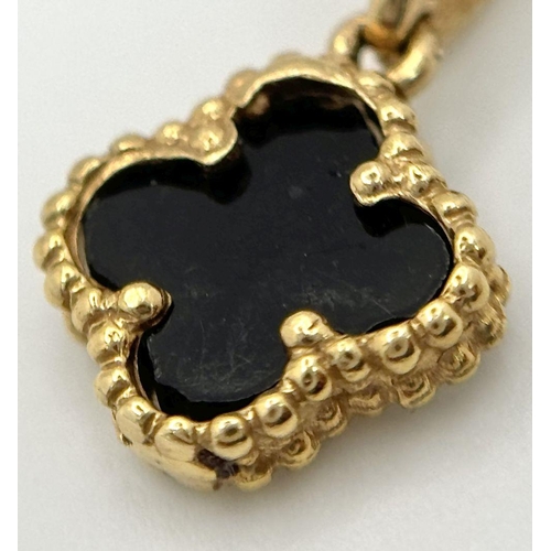 660 - An 18K Gold and Black Onyx Clover Pendant on an 18K Yellow Gold Disappearing Necklace. 12mm pendant.... 