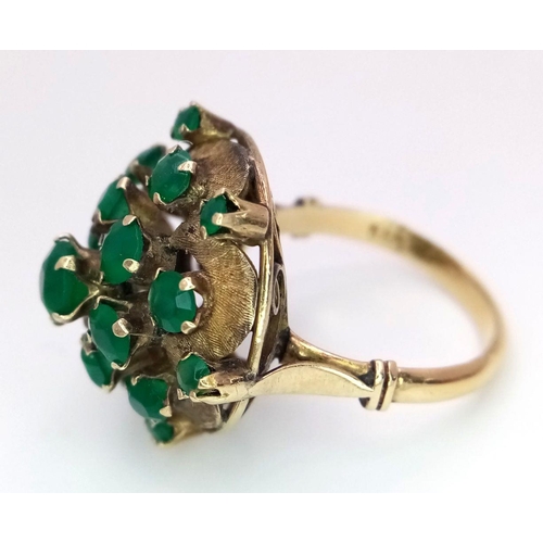 10 - A Vintage 14k Yellow Gold Emerald Ring. 20 graduating emeralds in circular floral form. Size L 1/2. ... 