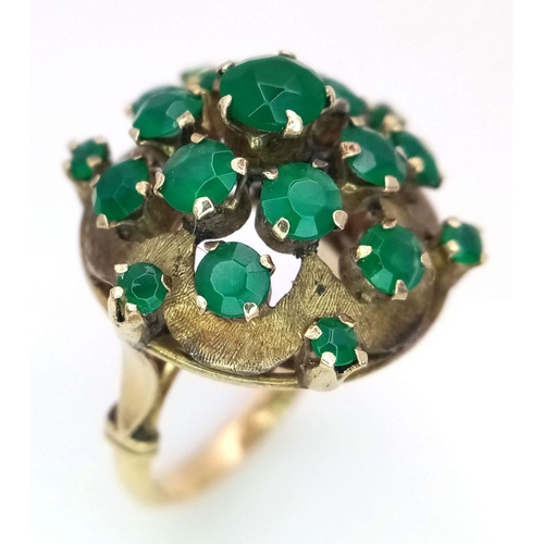 10 - A Vintage 14k Yellow Gold Emerald Ring. 20 graduating emeralds in circular floral form. Size L 1/2. ... 