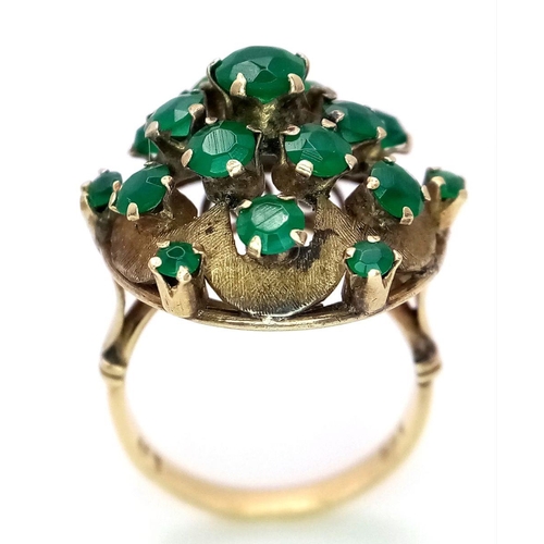 10 - A Vintage 14k Yellow Gold Emerald Ring. 20 graduating emeralds in circular floral form. Size L 1/2. ... 