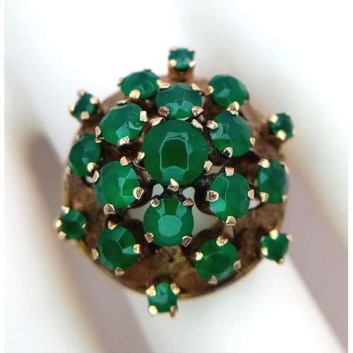 10 - A Vintage 14k Yellow Gold Emerald Ring. 20 graduating emeralds in circular floral form. Size L 1/2. ... 