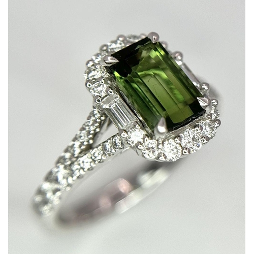 116 - An 18K White Gold Green Tourmaline Ring. Rectangular 1.63ct tourmaline with a sophisticated diamond ... 