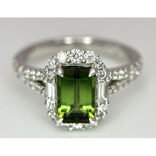 116 - An 18K White Gold Green Tourmaline Ring. Rectangular 1.63ct tourmaline with a sophisticated diamond ... 