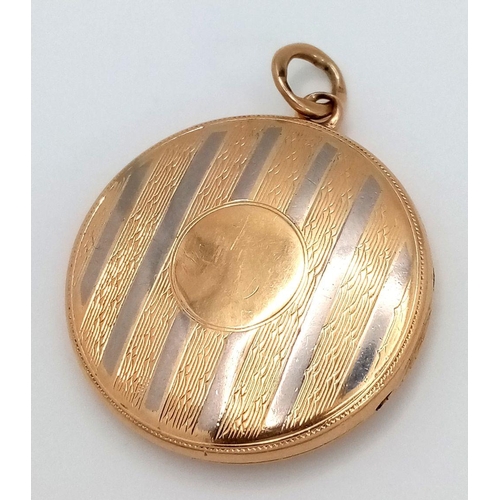 24 - A Vintage 18k Yellow and White Gold (tested) Locket Pendant. Circular form with vertical white lines... 