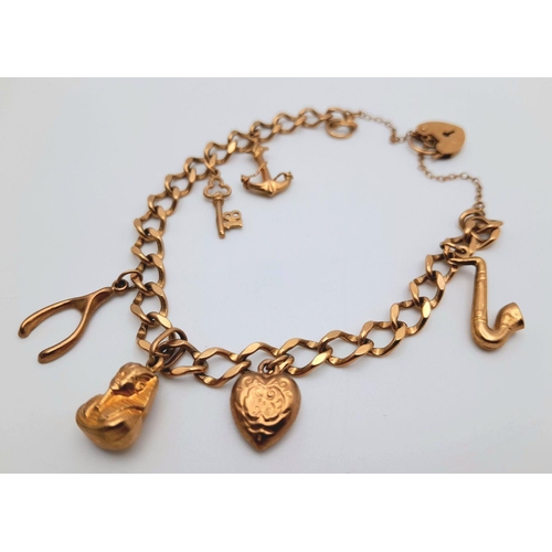 25 - A 9K Yellow Gold Charm Bracelet with Heart Clasp. Six charms including: anchor, sax and Tutankhamun!... 