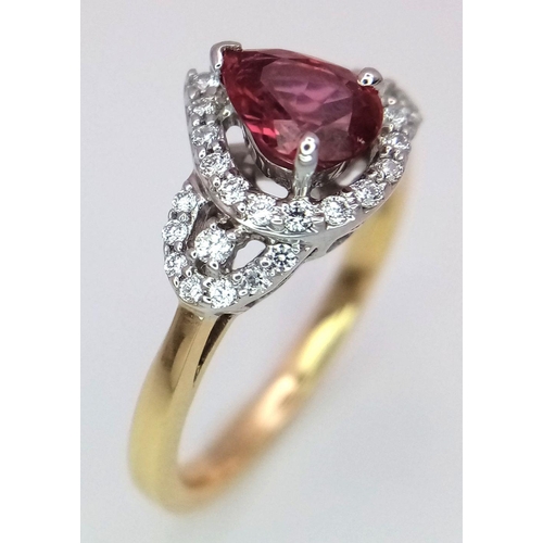 32 - An 18K White and Yellow Gold Ruby and Diamond Ring. 0.75ct pear-shaped central ruby with a diamond s... 