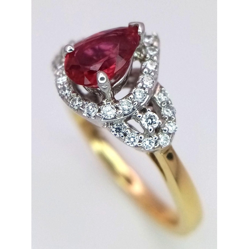 32 - An 18K White and Yellow Gold Ruby and Diamond Ring. 0.75ct pear-shaped central ruby with a diamond s... 