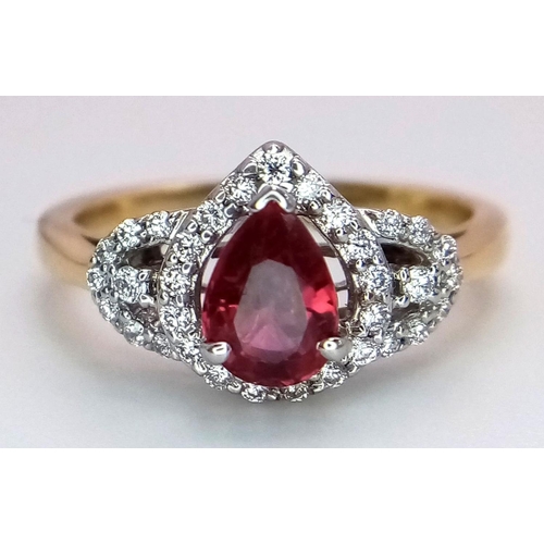 32 - An 18K White and Yellow Gold Ruby and Diamond Ring. 0.75ct pear-shaped central ruby with a diamond s... 