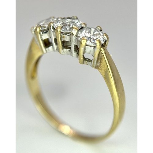 48 - AN 18K YELLOW GOLD DIAMOND 3 STONE RING - 0.90CT. 3.1G. SIZE N. 

REF: A/S 1086