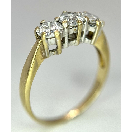 48 - AN 18K YELLOW GOLD DIAMOND 3 STONE RING - 0.90CT. 3.1G. SIZE N. 

REF: A/S 1086