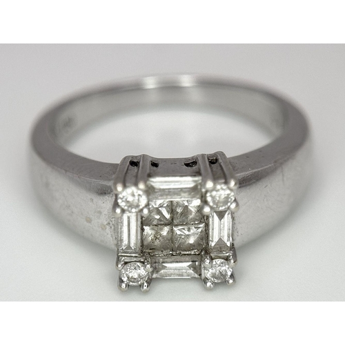 62 - AN 18K WHITE GOLD DIAMOND RING. 0.63CT. 5.4G. SIZE L.
REF: JR5