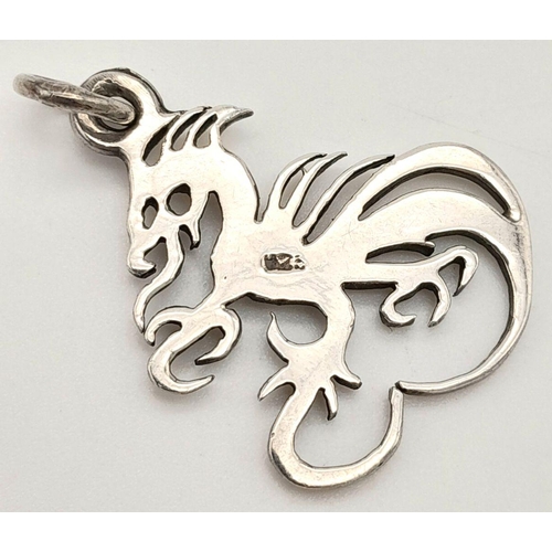 1224 - A STERLING SILVER CHINESE DRAGON PENDANT 3.7G TOTAL WEIGHT.

ref: SC 9101