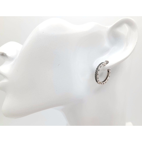 1225 - A pair of 925 silver Pandora stone set hoop earrings. Total weight 3.45G.