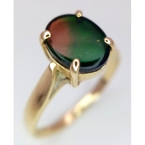 101 - A 14K Yellow Gold and Mystic Topaz Ring. Oval cut centre stone. Size O. 2.57g total weight.