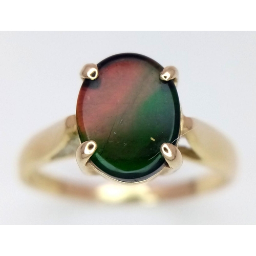 101 - A 14K Yellow Gold and Mystic Topaz Ring. Oval cut centre stone. Size O. 2.57g total weight.