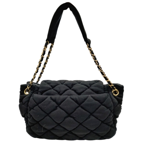 19 - A Chanel Bubble Quilted Flap Bag. Black quilted fabric exterior with gold-toned hardware, CC logo, d... 