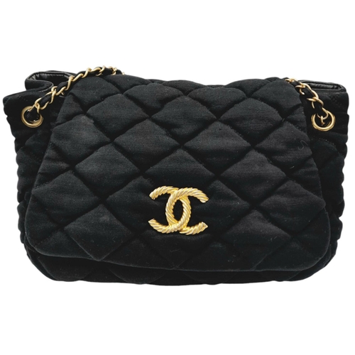 19 - A Chanel Bubble Quilted Flap Bag. Black quilted fabric exterior with gold-toned hardware, CC logo, d... 