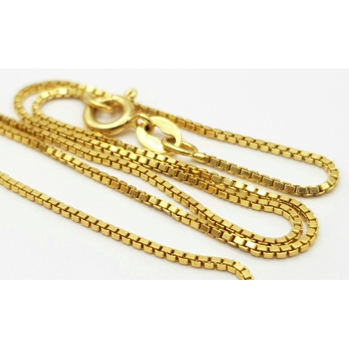 22 - An 18K Yellow Gold Necklace with Hanging Ball Tassel Decoration. 40cm length. 12.5g total weight.