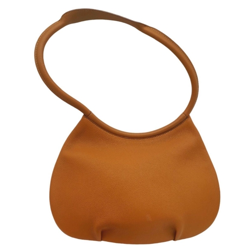 47 - An Hermes Togo Cacahuete Bag. Brown leather exterior, silver-toned hardware and a single circular le... 