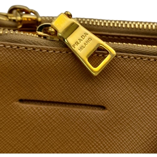 54 - A Prada Camel Large Bag. Leather exterior with gold-toned hardware, two rolled leather handles, four... 