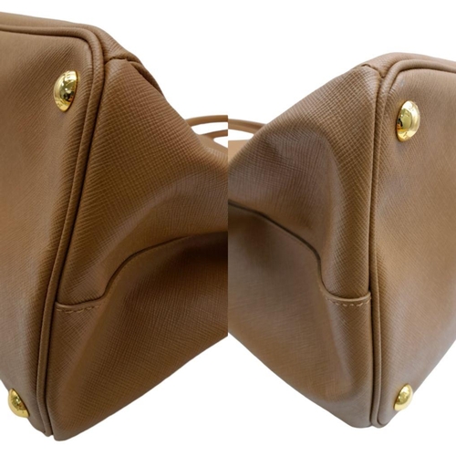 54 - A Prada Camel Large Bag. Leather exterior with gold-toned hardware, two rolled leather handles, four... 