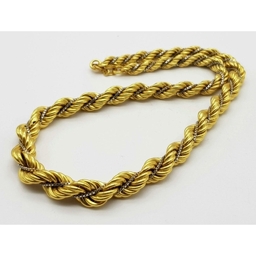 6 - A Graduating 18K Yellow Gold Rope Chain Intertwined with an 18K White Gold Venetian Chain. 40cm. 44.... 