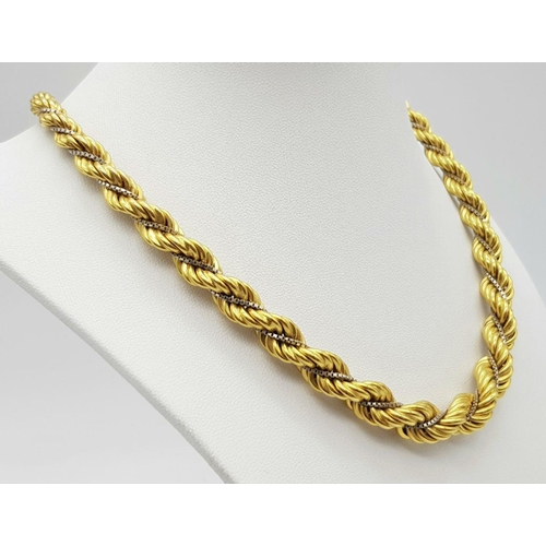 6 - A Graduating 18K Yellow Gold Rope Chain Intertwined with an 18K White Gold Venetian Chain. 40cm. 44.... 