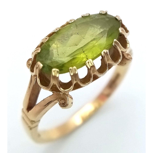 21 - Stunning 14 carat GOLD and PERIDOT RING. Having a large oval cut PERIDOT set to top in beautiful cra... 