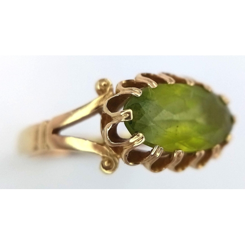 21 - Stunning 14 carat GOLD and PERIDOT RING. Having a large oval cut PERIDOT set to top in beautiful cra... 