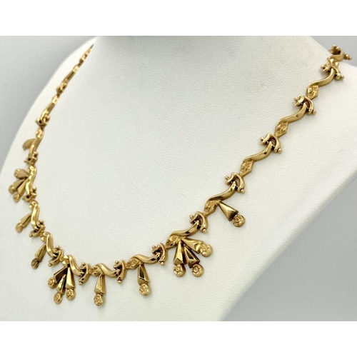 5 - AN 18K GOLD DESIGNER NECKLACE BASED ON THE 