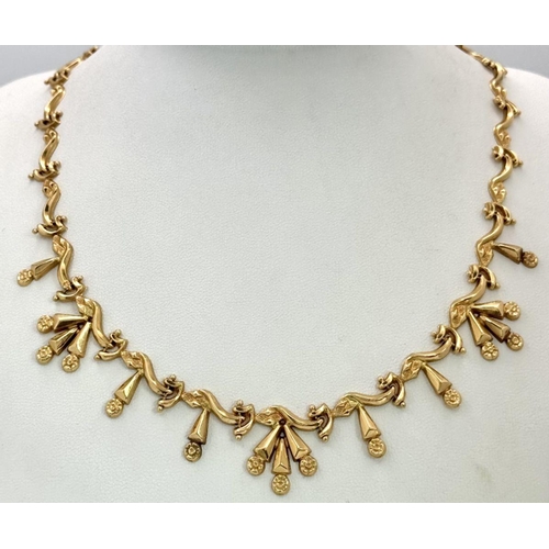 5 - AN 18K GOLD DESIGNER NECKLACE BASED ON THE 