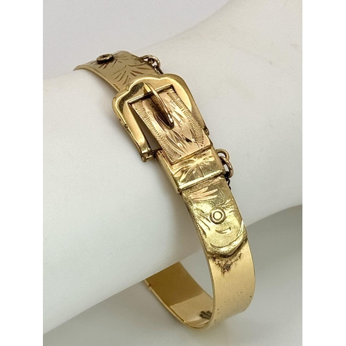 98 - Vintage ROLLED GOLD BUCKLE BANGLE. Complete with safety chain. Presented in jewellers box.  17.4 gra... 