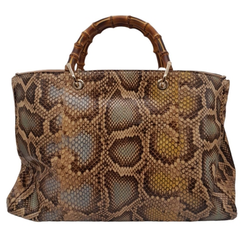 33 - A Gucci Python Bamboo Top Handle Bag. Python skin exterior in shades of brown and beige, gold-toned ... 