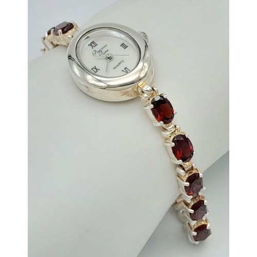 633 - Ladies Sterling Silver Garnet Set Bracelet Watch by Precious Time. 18mm Case. Set with 6mm Oval Cut ... 