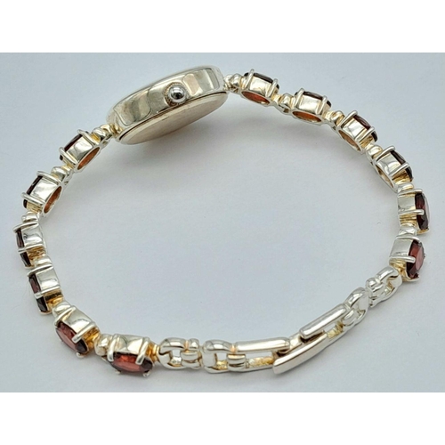 633 - Ladies Sterling Silver Garnet Set Bracelet Watch by Precious Time. 18mm Case. Set with 6mm Oval Cut ... 