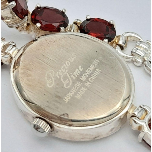 633 - Ladies Sterling Silver Garnet Set Bracelet Watch by Precious Time. 18mm Case. Set with 6mm Oval Cut ... 