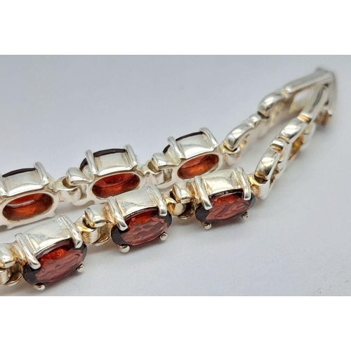 633 - Ladies Sterling Silver Garnet Set Bracelet Watch by Precious Time. 18mm Case. Set with 6mm Oval Cut ... 