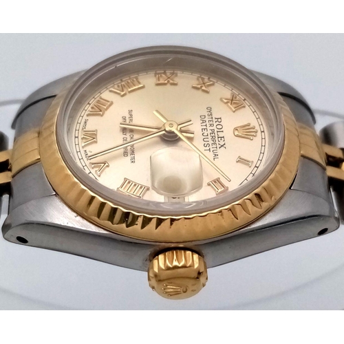 106 - A Rolex Oyster Perpetual Ladies Datejust Watch. Bi-metal (gold and steel) bracelet and case - 26mm. ... 